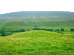 Worsaw Hill burial mound in the shadow of Pendle Hill.